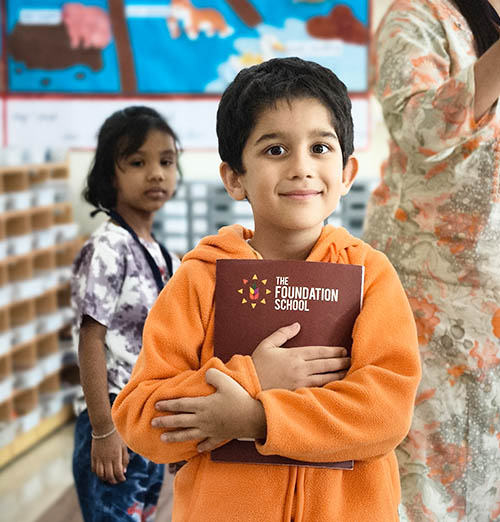 Student with The Foundation School journal